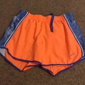 Blue and orange nike running shorts